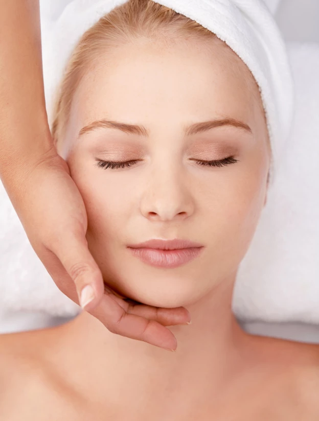 Face, Massage and Woman at a Spa with Hands of Masseuse for Lymphatic Drainage Procedure from above. Zen, Peace and Female with Facial Therapy at Beauty Salon for Skincare, Wellness or Stress