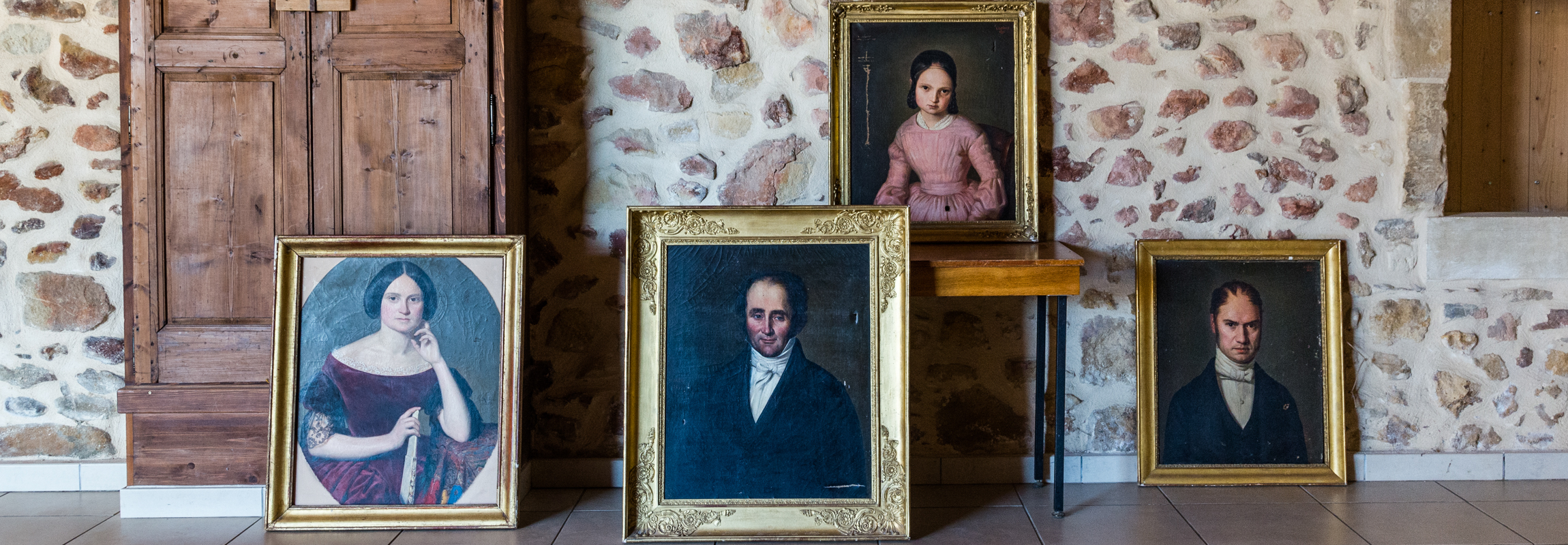 Four portraits show the builder of Chateau de Montcaud, Alexandre Eugène Collain, and three of his descendants. Located in Provence, Southern France, the property was first converted into a hotel in the 1990s and reopened in summer 2018 after extensive renovation.