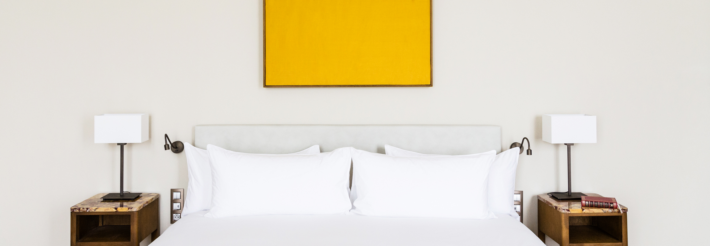 The beds at hotel Chateau de Montcaud are adorned by a silk panel, a symbolic reminder of the chateau's origins: May your dreams be made of silk should as they accompany your nights in Provence, Southern France.